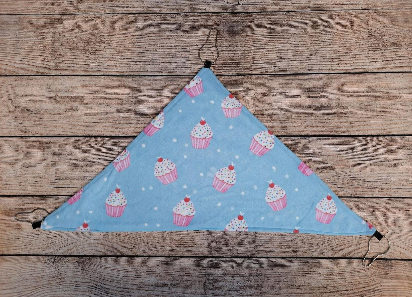 This custom fleece corner hammock is designed for comfort, warmth, and space-saving — the perfect lounging spot for guinea pigs, rats, ferrets, and other small pets. Made with ultra-soft fleece and strong, secure hooks, it easily attaches to any cage corner to create a snug, elevated bed your pet will love. This space-saving hanging bed is perfect for guinea pigs, rats, ferrets, and other small animals who love to relax in warmth and comfort.